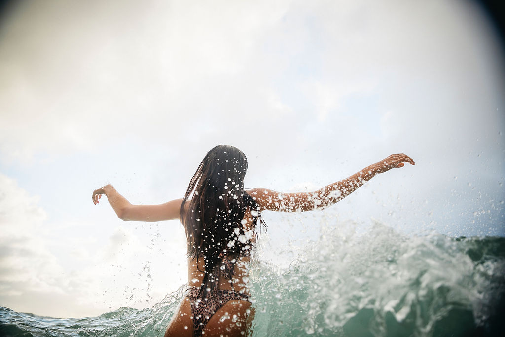 girl in ocean, waves, underwater