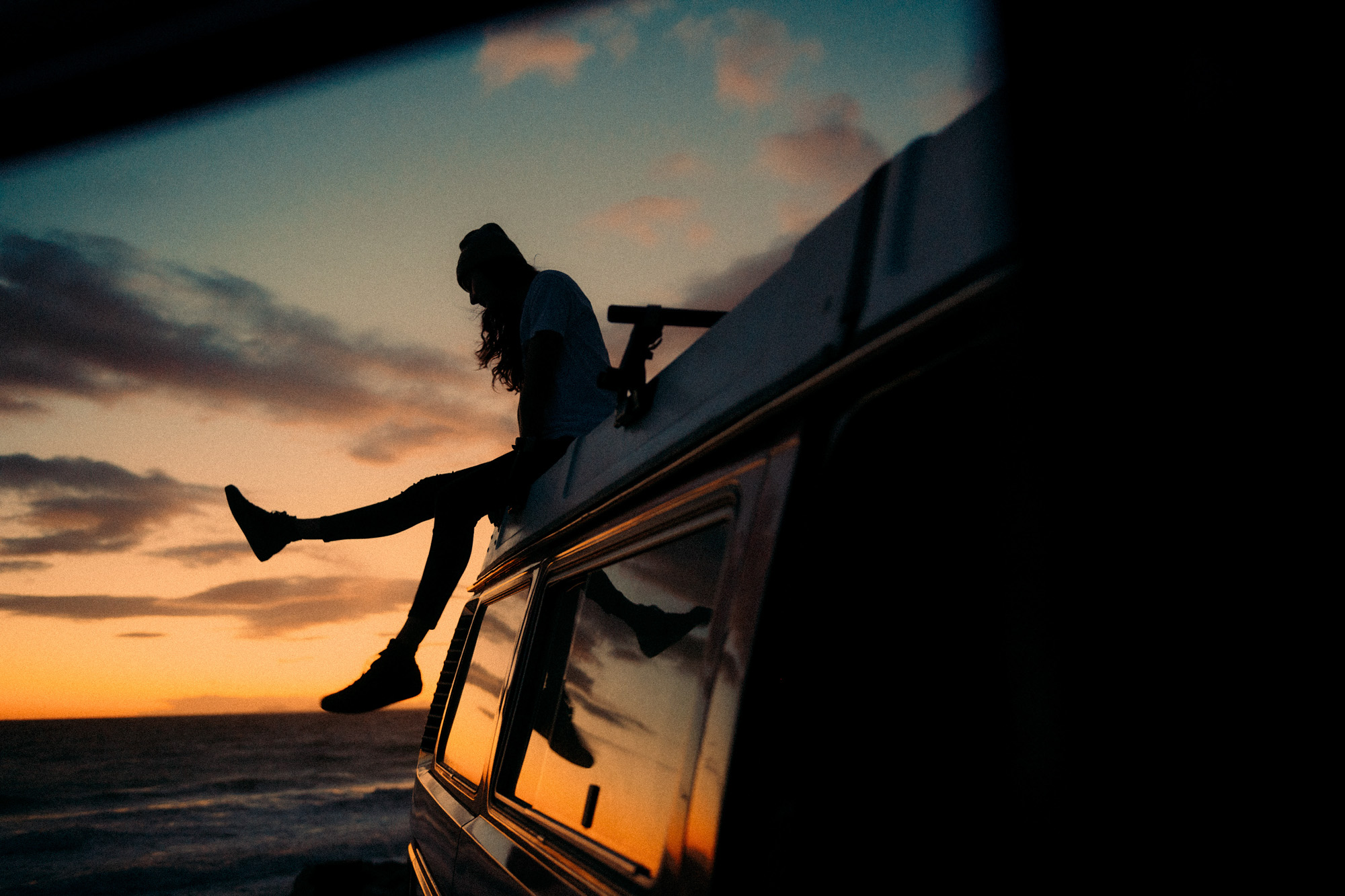 Lifestyle photographer Caleb Kuhl photographs beach sunsets with a Westfalia van