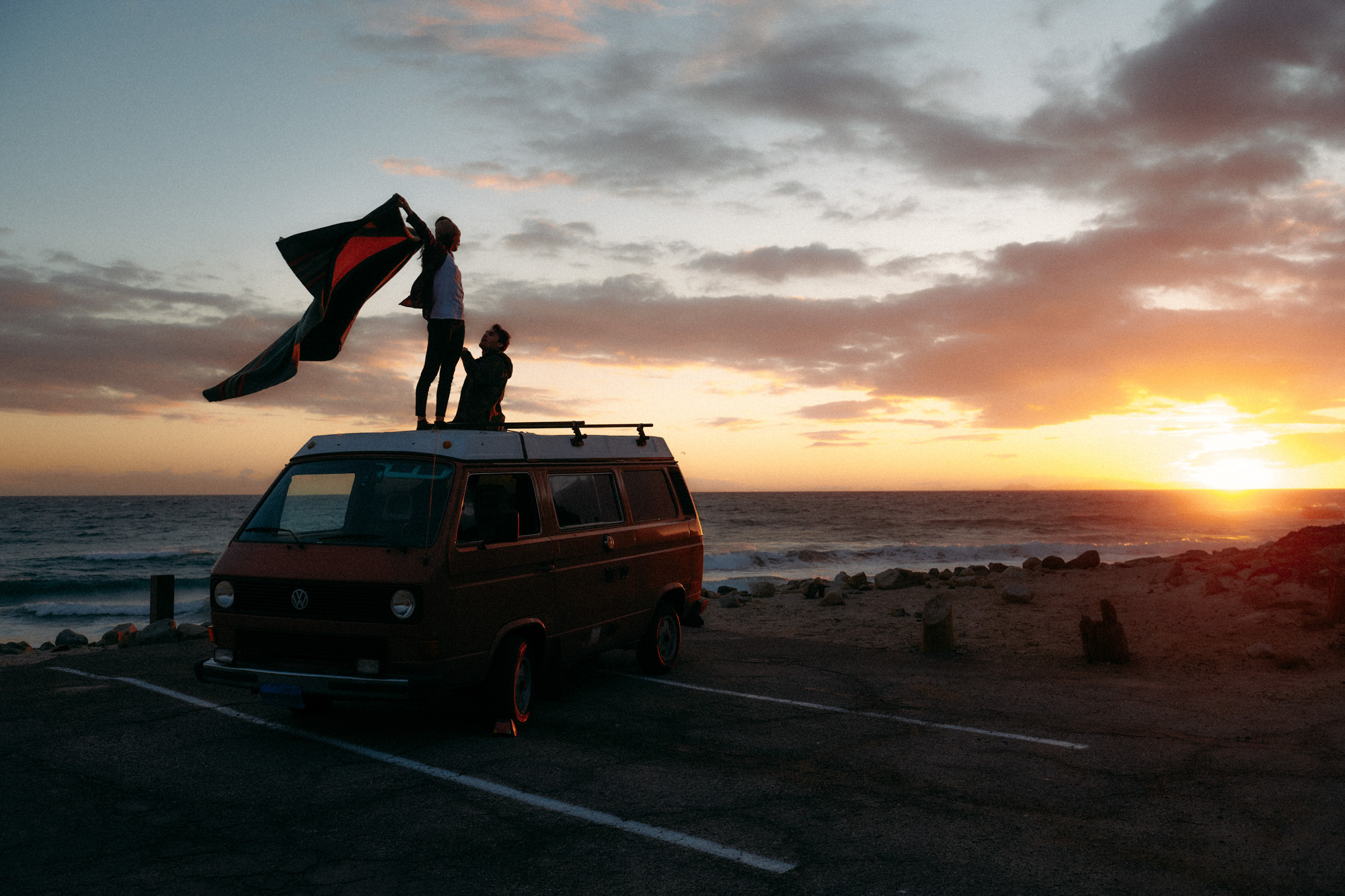 Lifestyle photographer Caleb Kuhl photographs beach sunsets with a Westfalia van